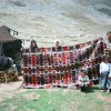 A large Karakoyunlu kilim on the Anamas Yayla with weavers (Harald Böhmer, Nomads in Anatolia 2008)